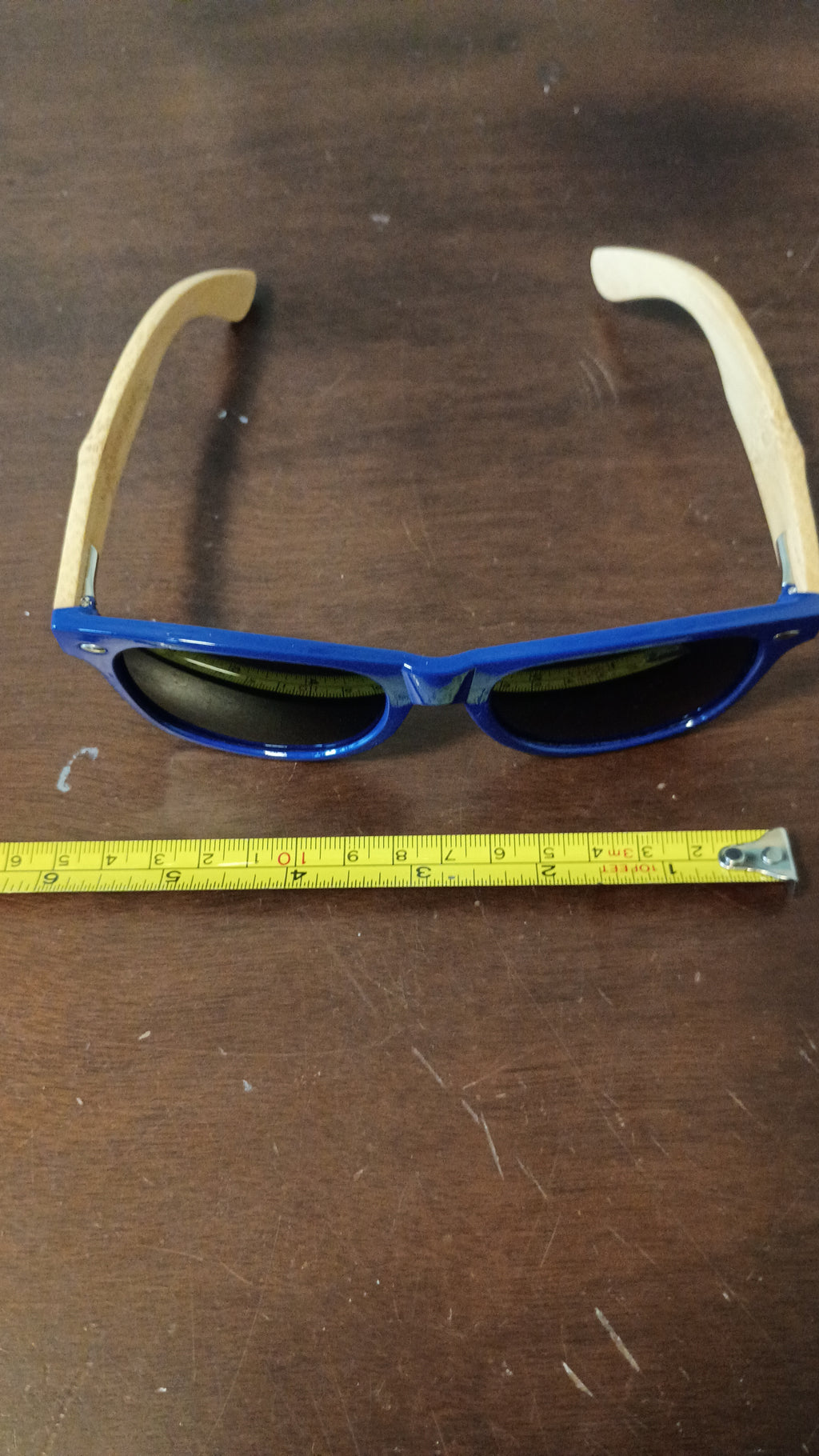 eco-friendly" or "wood-arm" wayfarer.