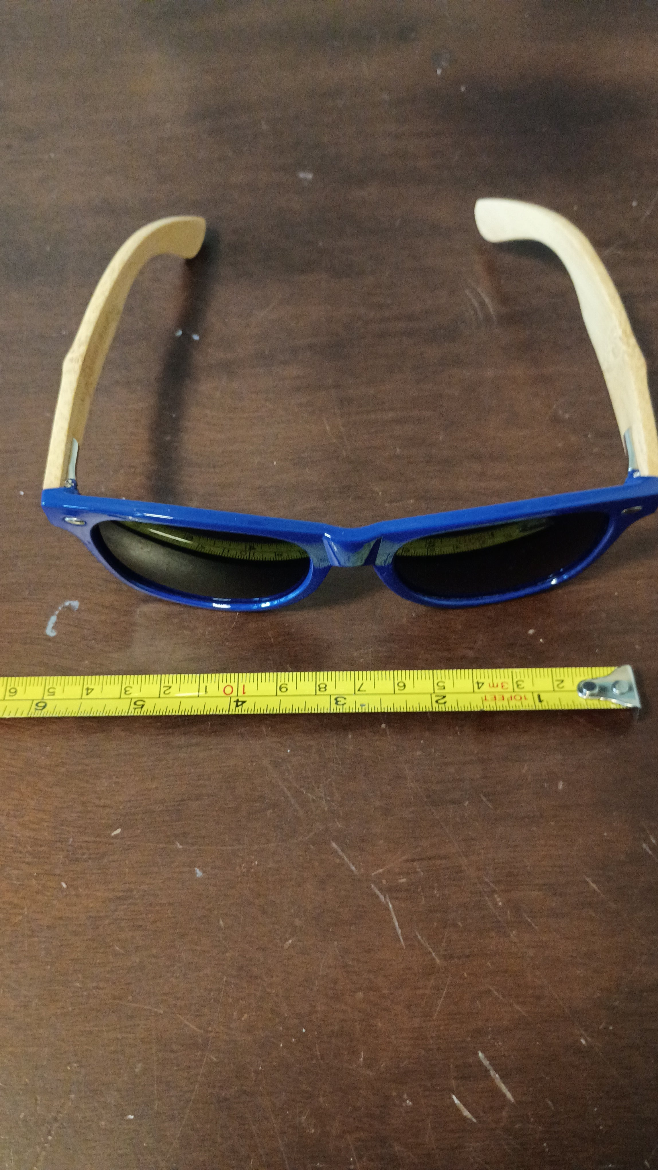 eco-friendly" or "wood-arm" wayfarer.