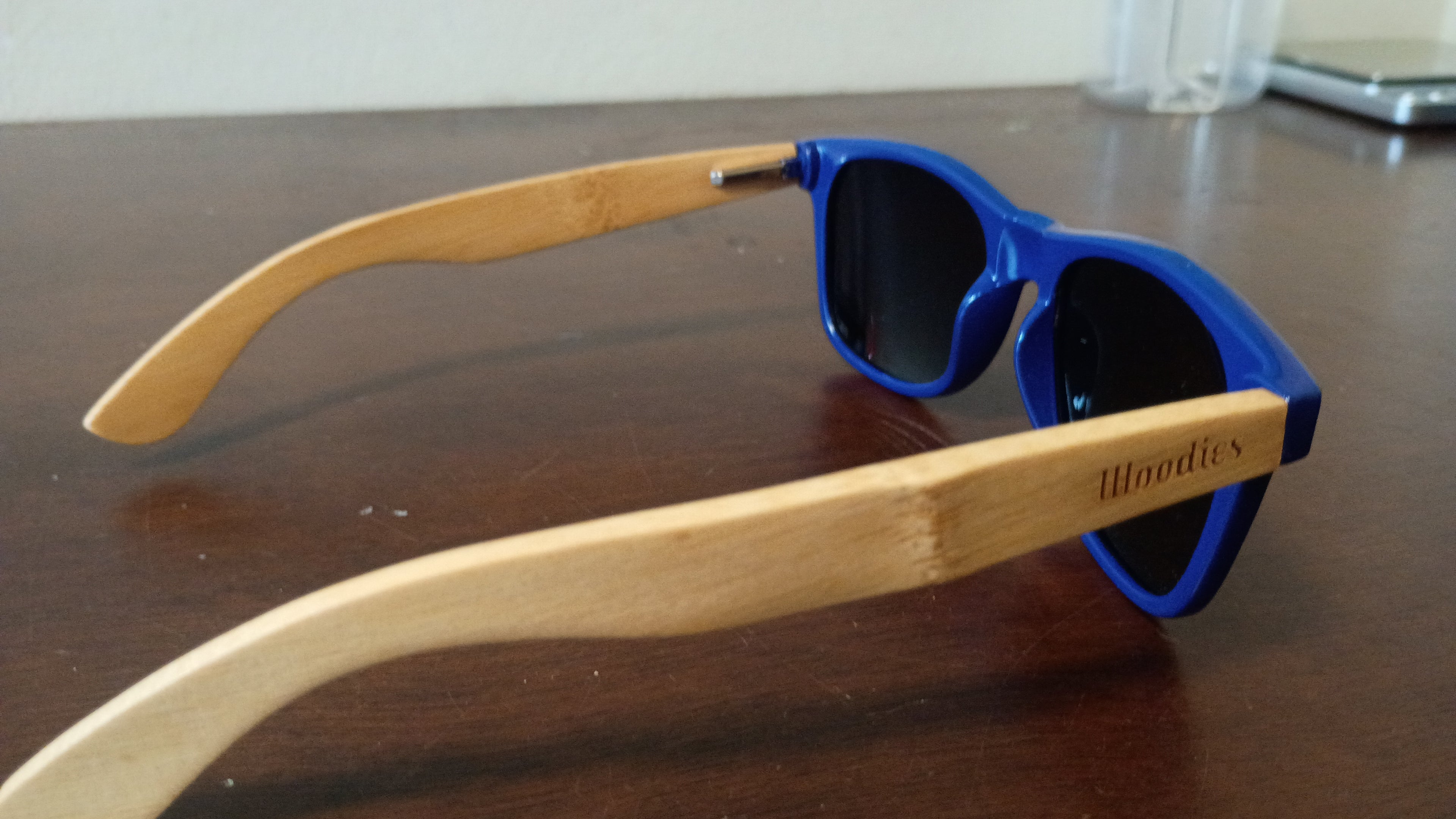 eco-friendly" or "wood-arm" wayfarer.