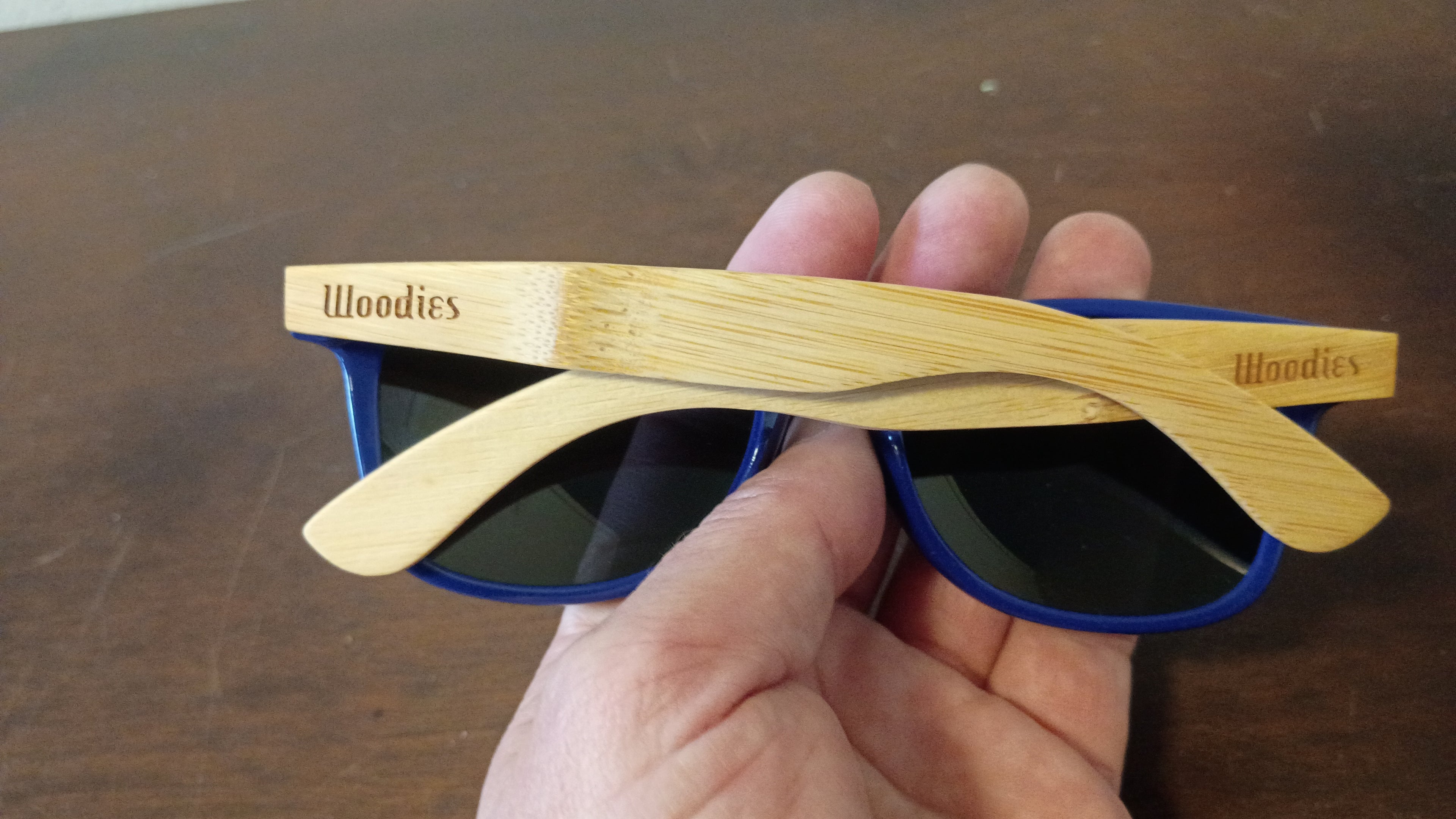 eco-friendly" or "wood-arm" wayfarer.